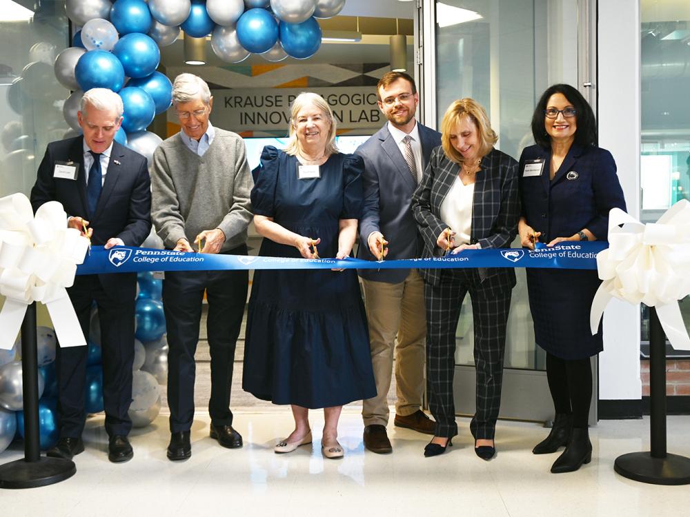 The ceremonial ribbon is cut to celebrate the opening of the Krause Pedagogical Innovation Laboratory.