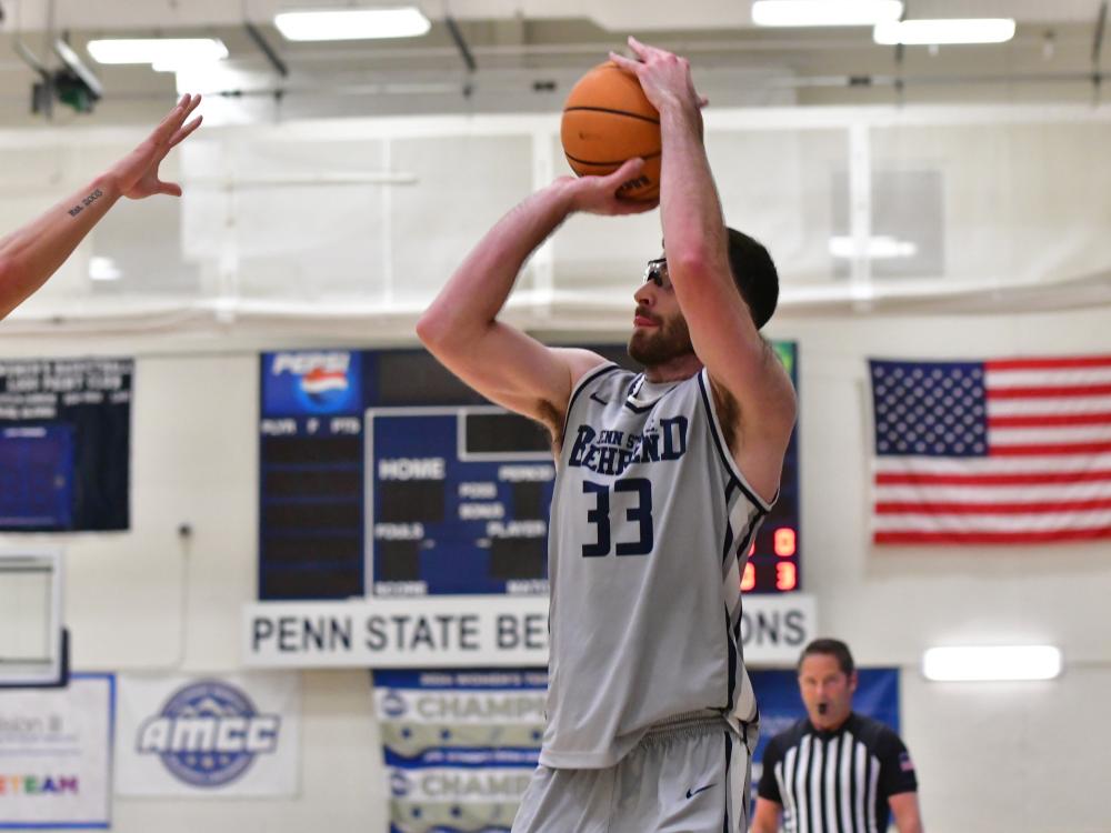 Penn State Behrend basketball player Tommy DiRienzo shoots the ball.