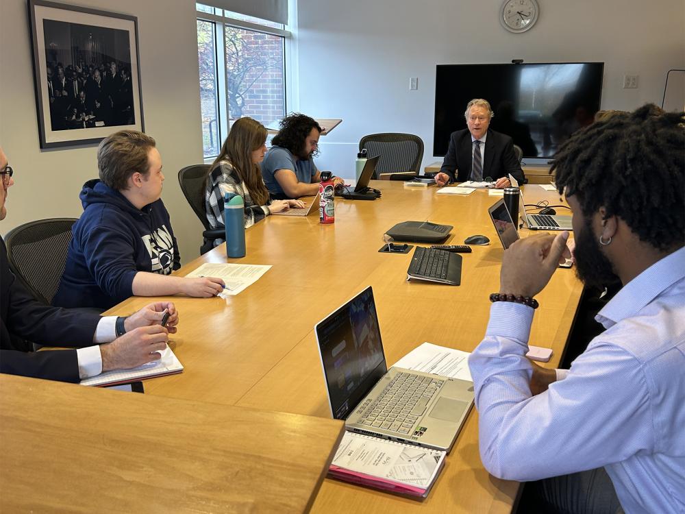 Penn State Law Civil Rights Appellate Clinic members sit around a discussion table