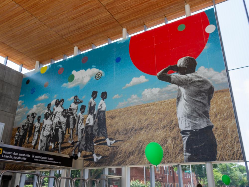 Mural showing young people of color walking across a Midwestern prairie