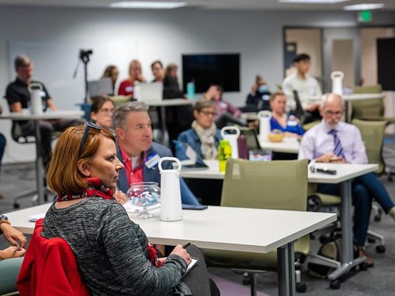 Penn State faculty listening to a presentation on factors that influence student success. 