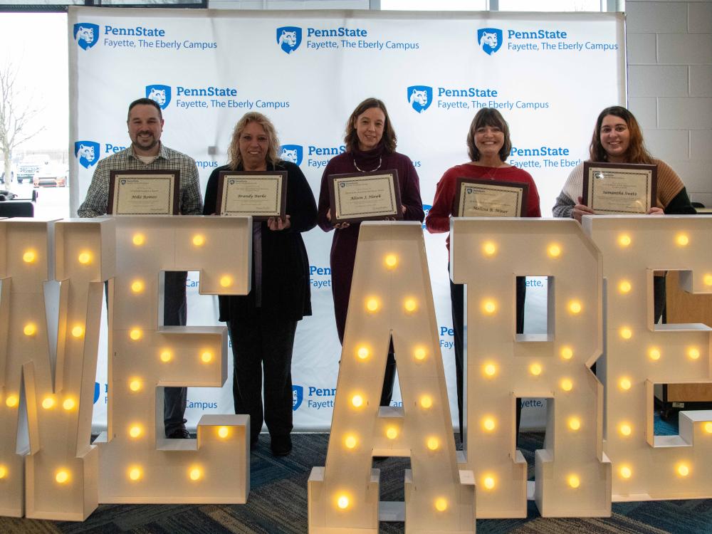 L-R: Mike Romeo, Brandy Burke, Alison Hawk, Melissa Miner, and Samantha Swetz holding their awards.