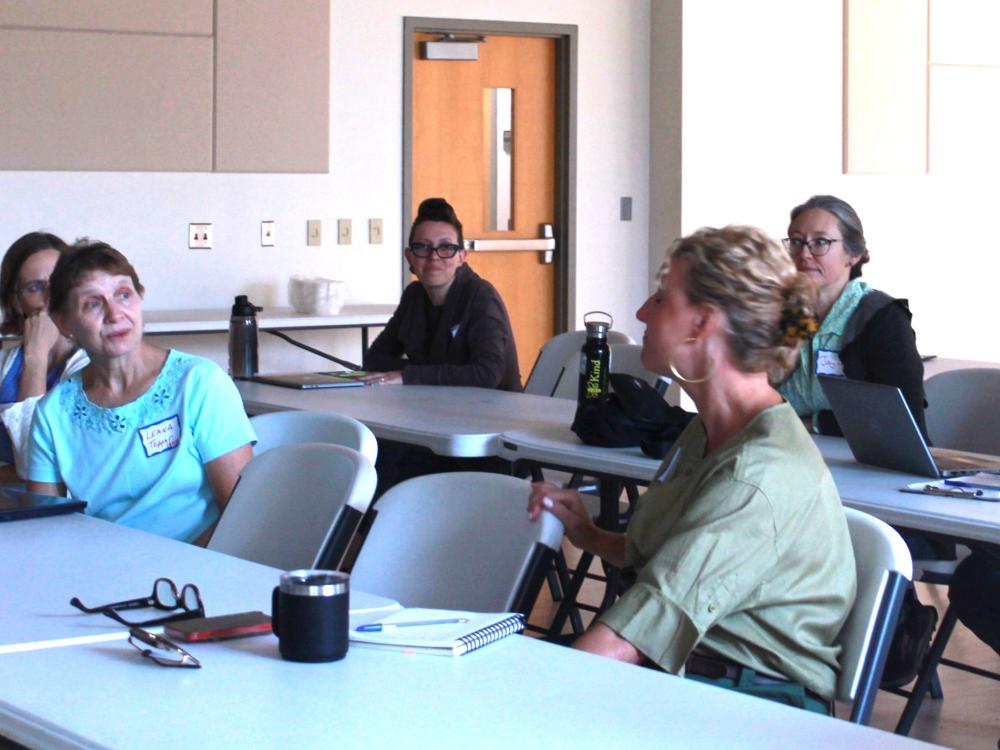 A group of faculty in a classroom during a training 