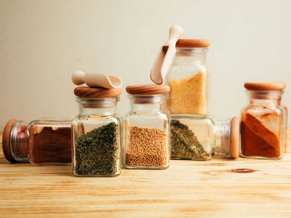 Small bottles of different herbs and spices