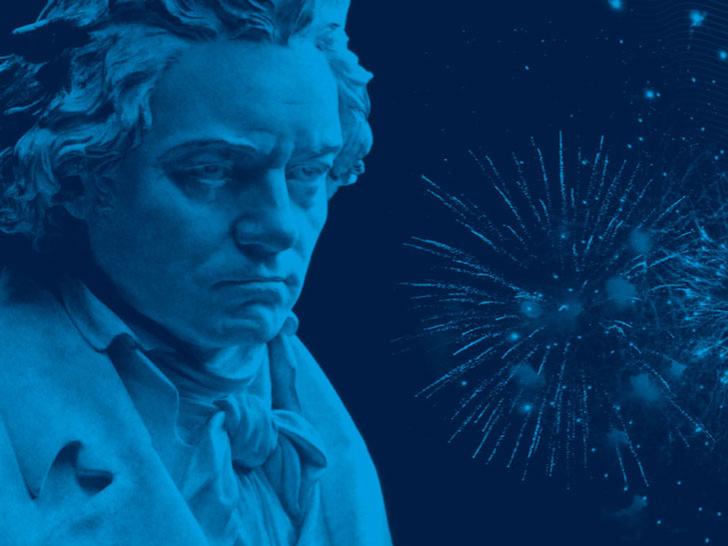 A bust of a piano composer is shown next to fireworks.