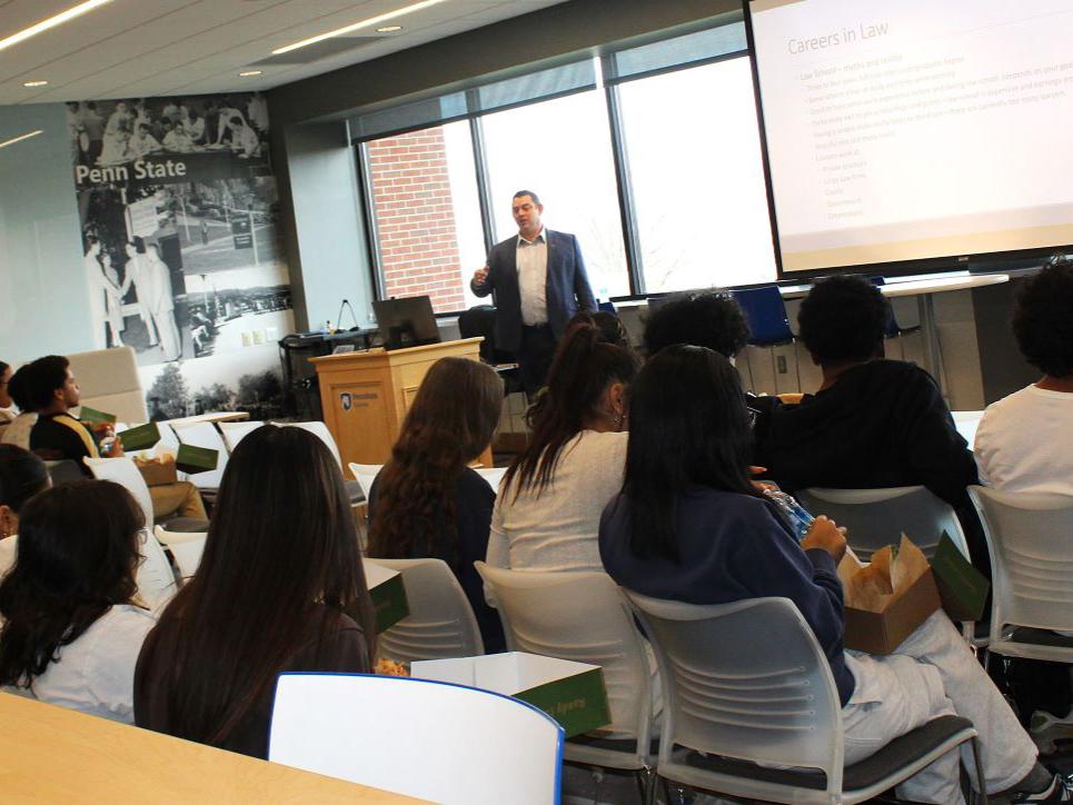 Attorney Joseph Litvak talks to students in the Sherbine Lounge