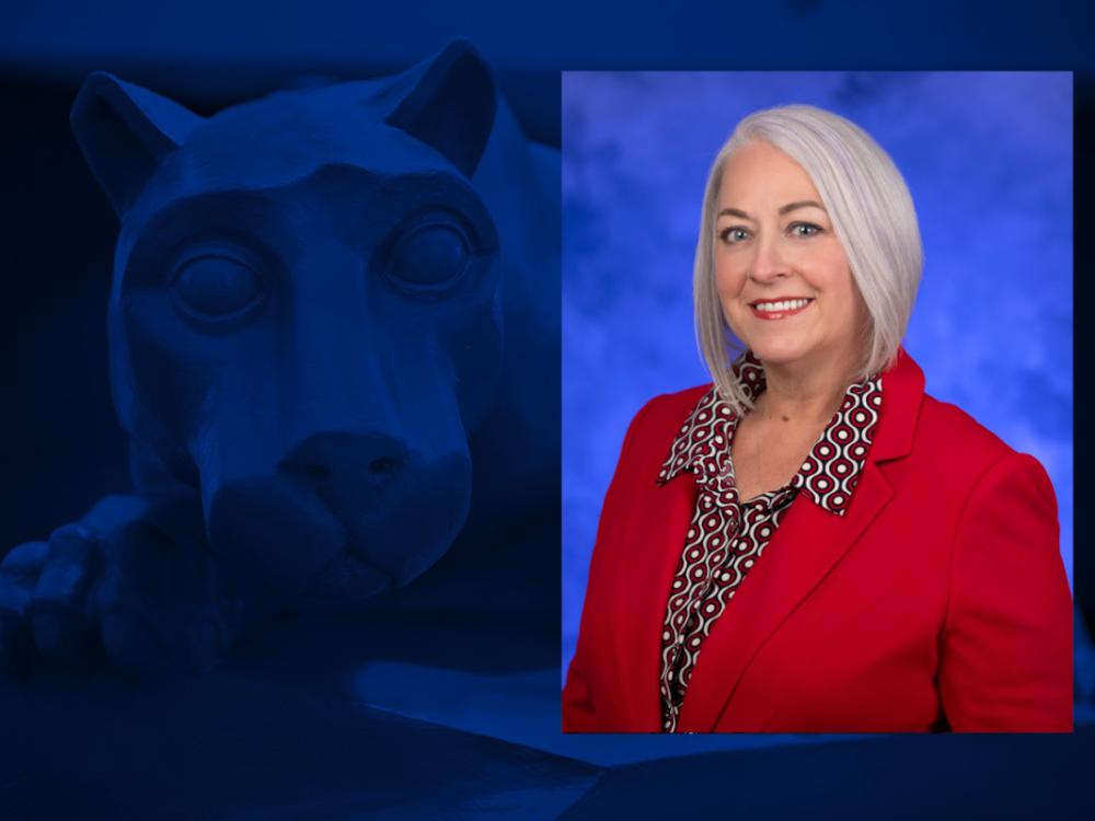 A headshot of Teresa Swenson, wearing professional attire, placed over an image of a Penn State Nittany Lion statue. 