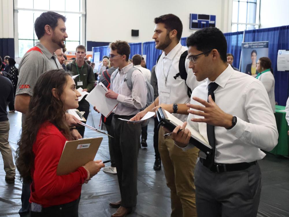 Students talk with recruiters at a Penn State Behrend career fair.