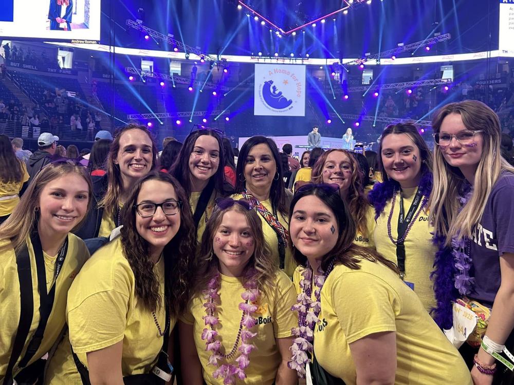 Representatives from Penn State DuBois, including this year’s THON dancers from the campus, gather on the dance floor at the Bryce Jordan Center during THON 2025.