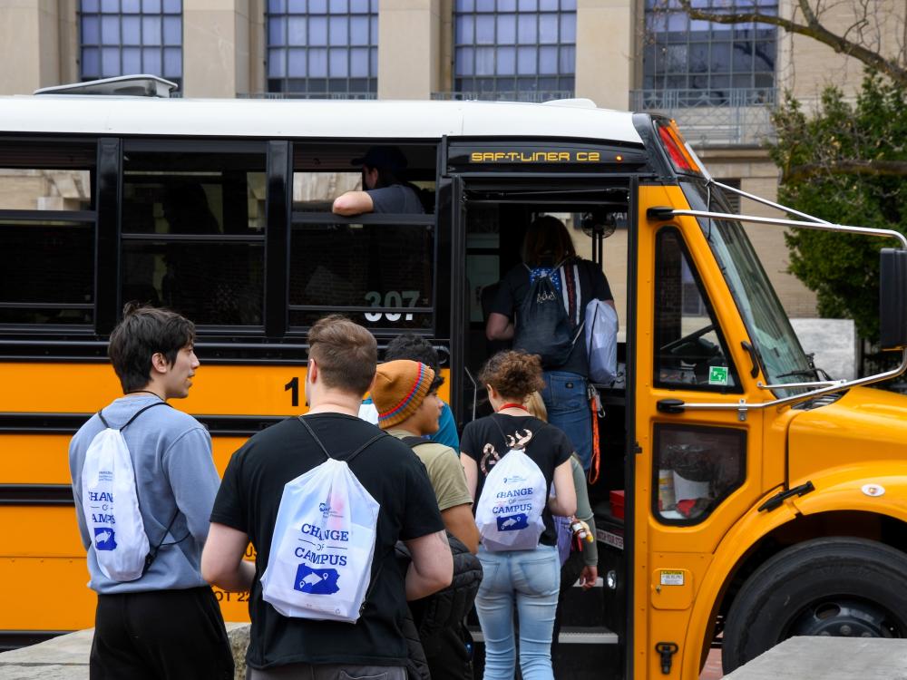 Students waiting in line to enter school bus