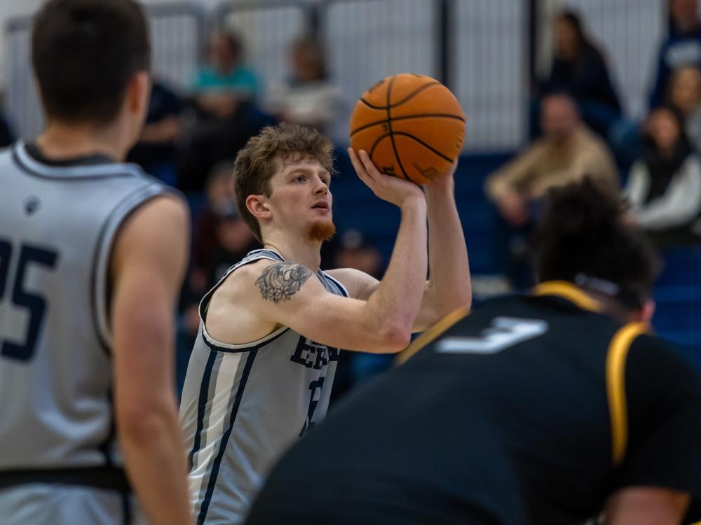 A Penn State Behrend basketball player shoots a free throw.