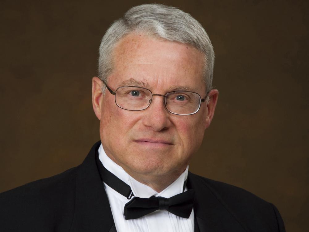 Former Blue Band Director O. Richard Bundy Jr. poses for a portrait in a tuxedo.