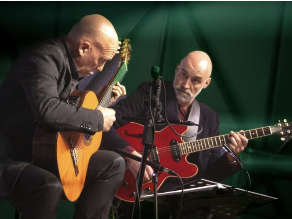 Roberto Fabbri and Fabio Macera playing guitars