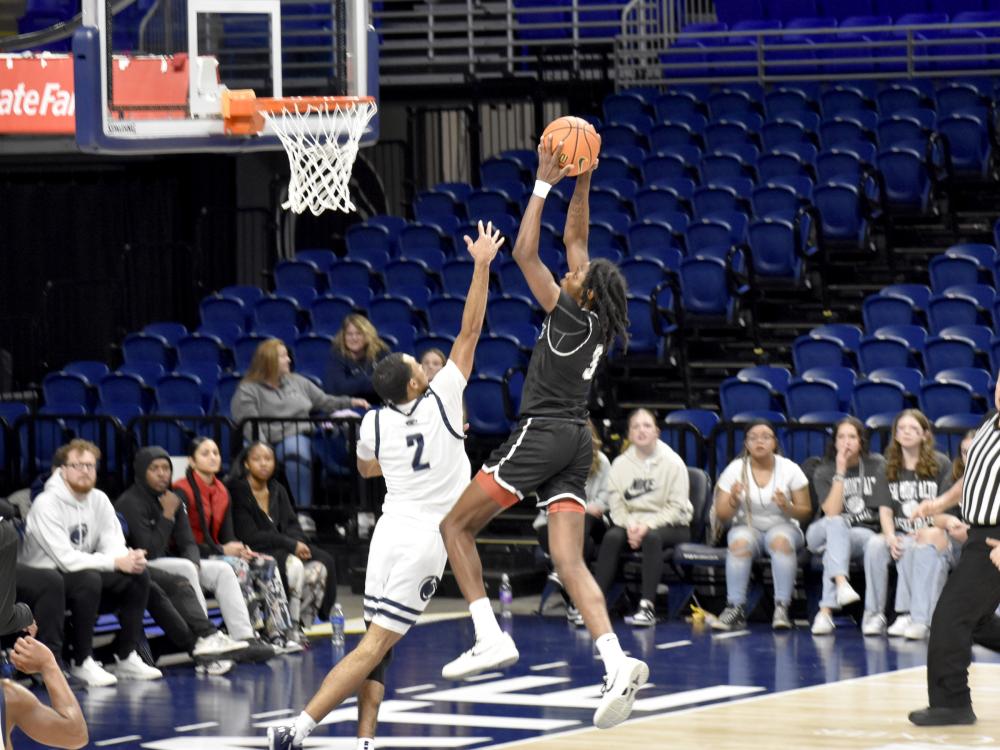 Penn State DuBois junior guard Niare Poplar goes up to slam the ball for a score during the PSUAC championship game at the Bryce Jordan Center.