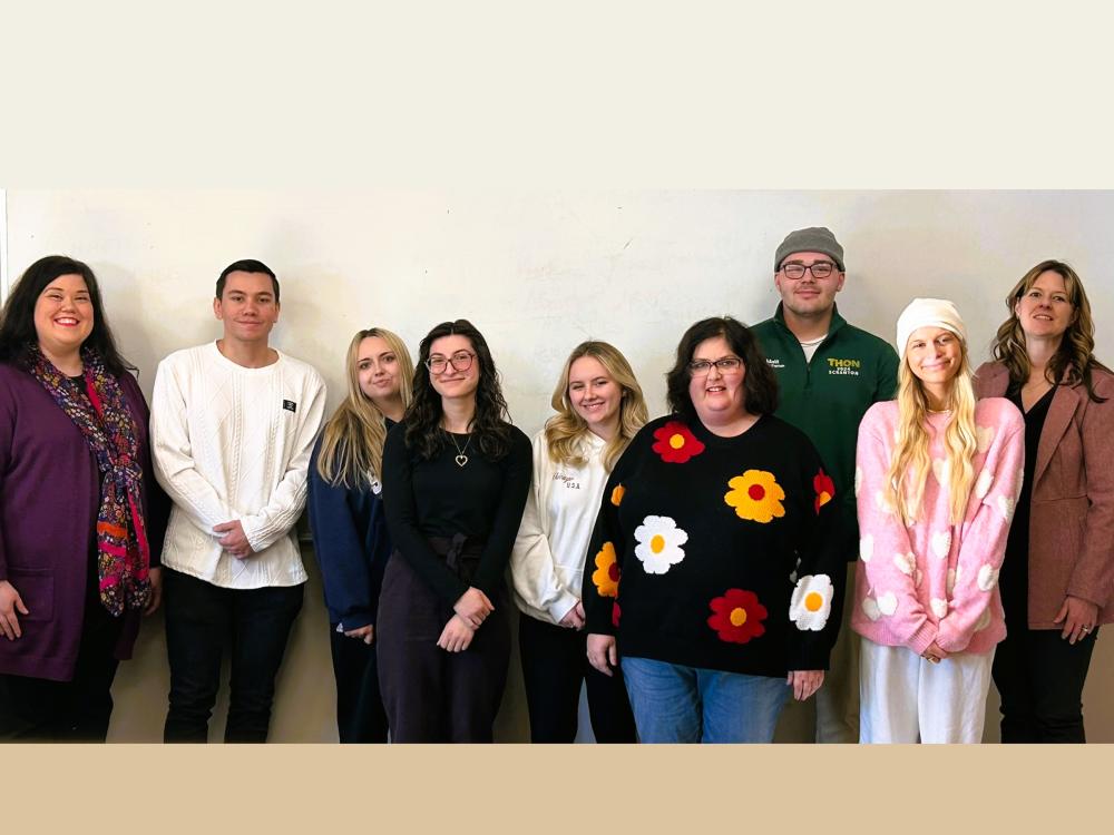 Professor Longo poses with her students and recent guest speaker