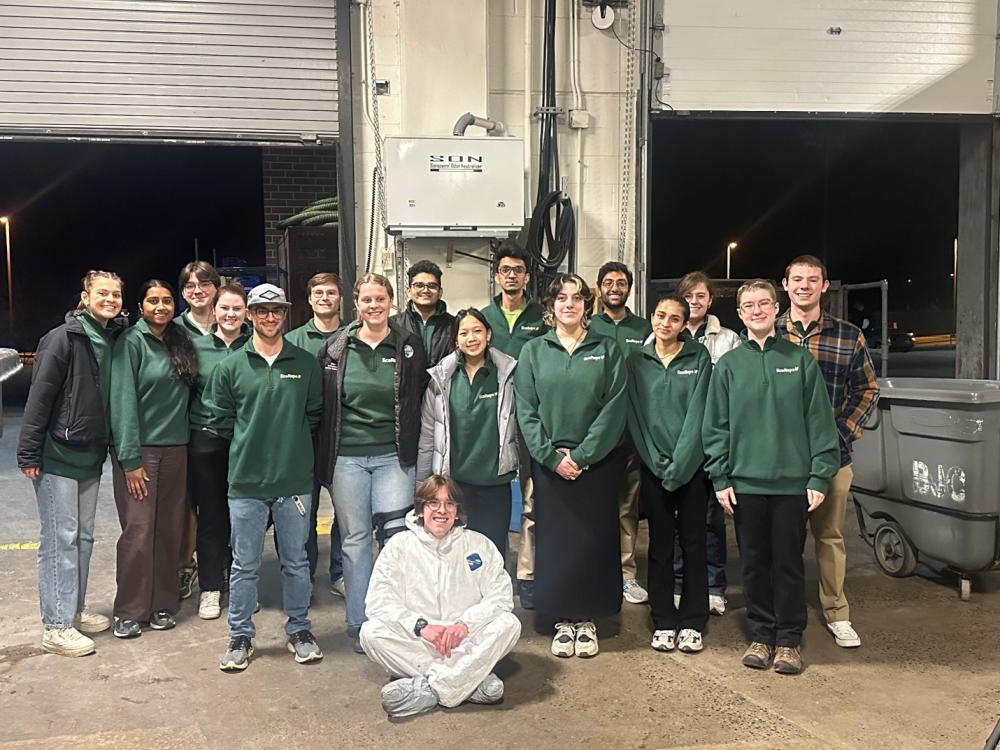A group of students dressed to sort waste