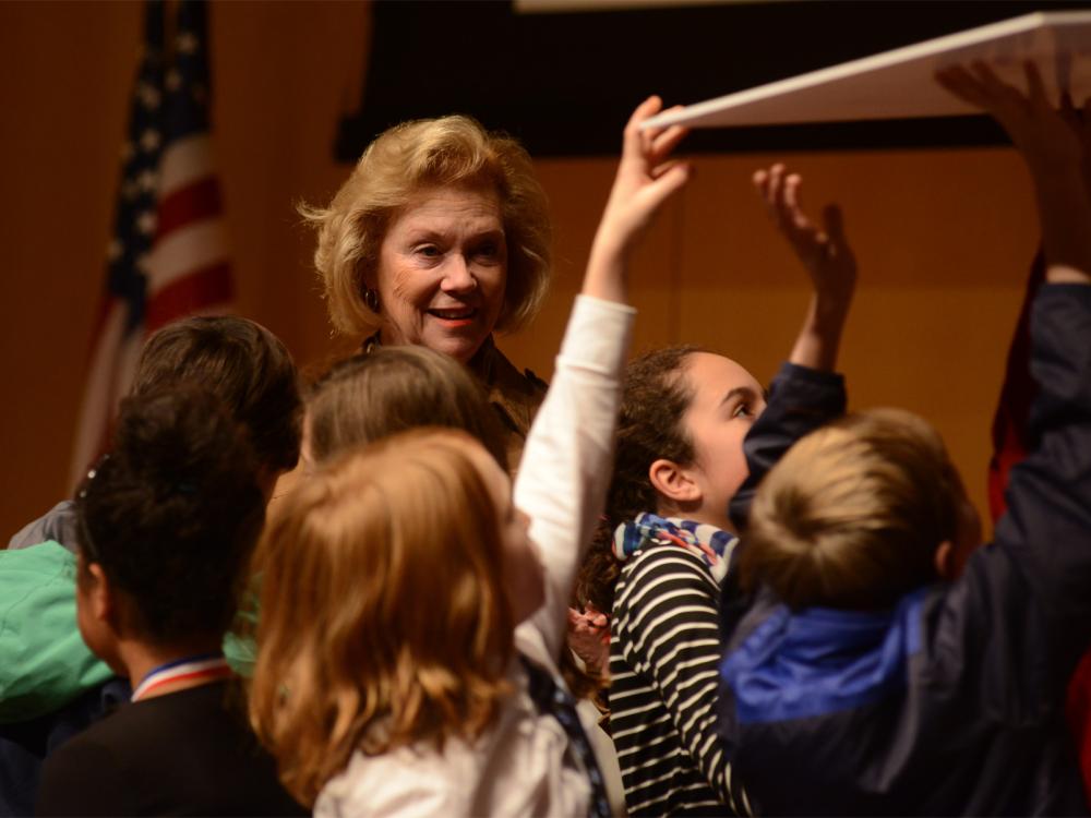 Marjorie Rendell watching a group of students at a Rendell Center event.