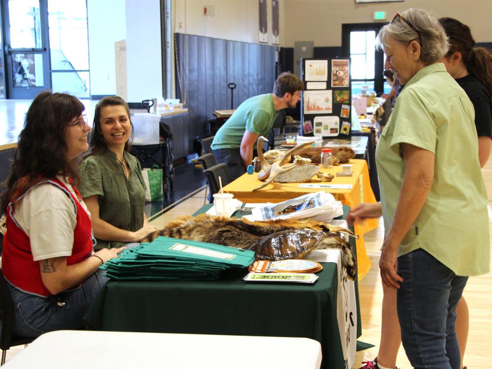 Representatives from the Clearfield County Conservation District speak with members of the public during the earth day celebration at Penn State DuBois.