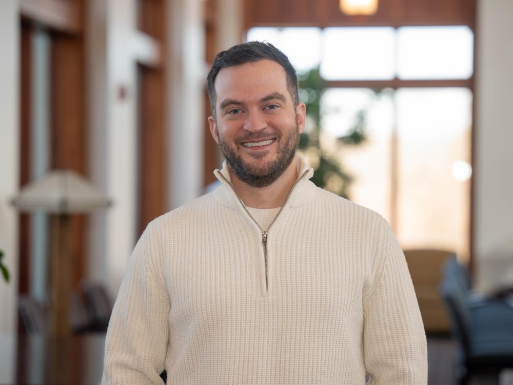 A portrait of Alumni Achievement Award recipient Connor Sattely