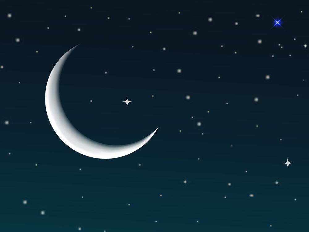 a crescent moon in the night sky