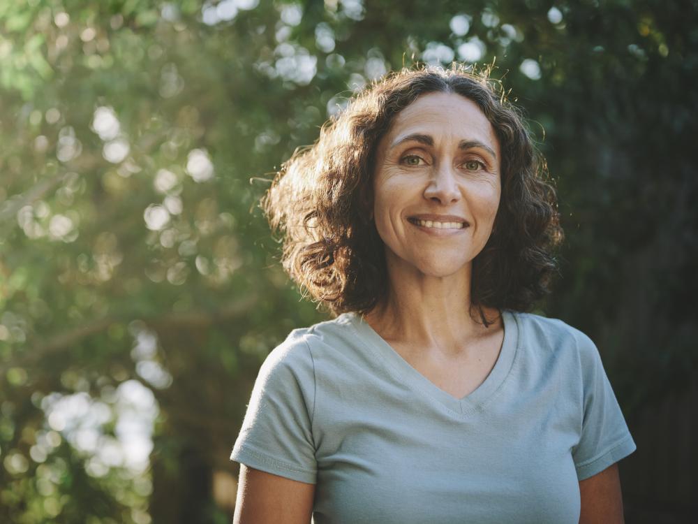 smiling woman outside in park