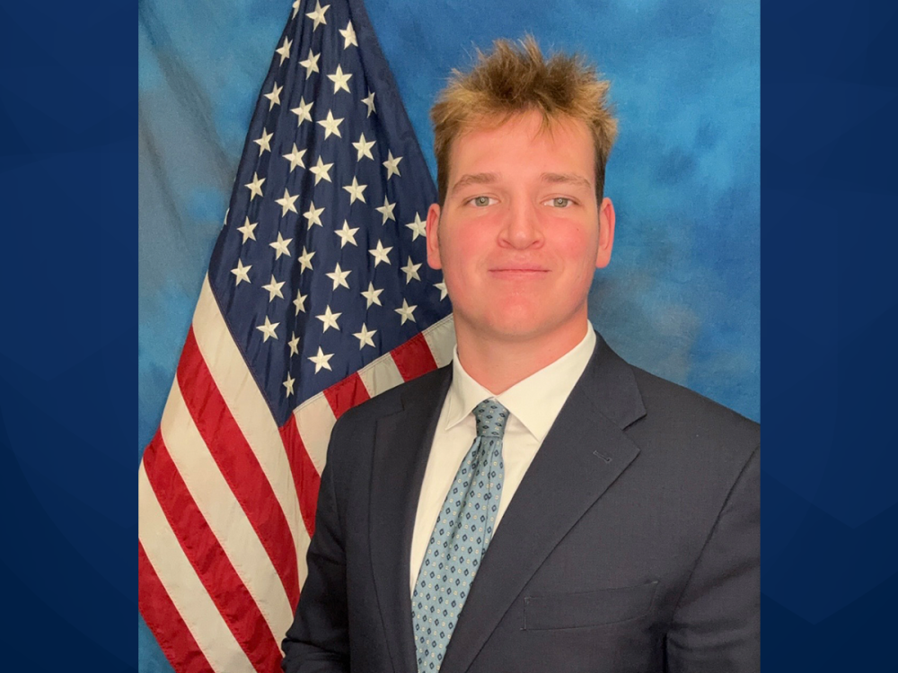 Portrait of Drew Gochnauer with a U.S. flag
