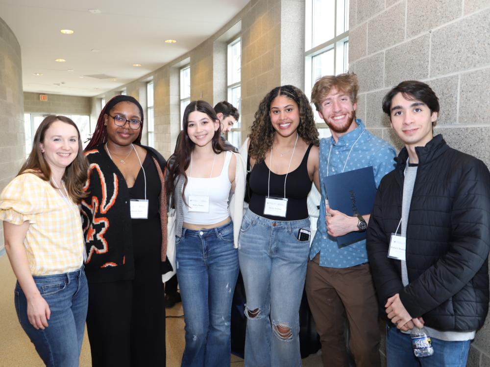students and professor posing for photo