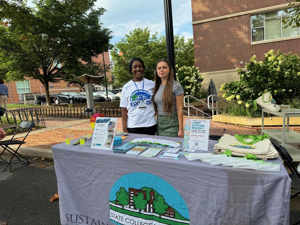 Jasmine Fields greets public at outdoor booth.