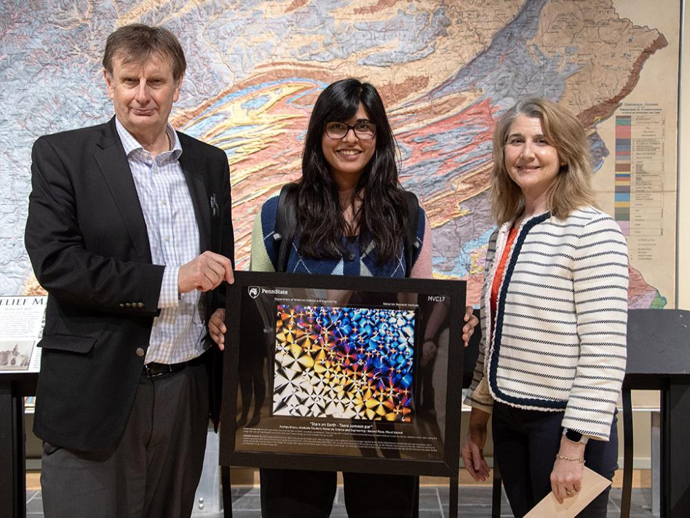 The Materials Visualization Competition celebrates the quality of research in materials at Penn State and promotes awareness of materials science through visualization. Presenting the MVC17 second place award for Visual Appeal for the image “Stars on Earth - Taare zameen par,” from left, Clive Randall, director of the Material Research Institute; Arshiya Bhadu, winner and graduate student, Department of Materials Science and Engineering; and Susan Sinnott, department head and professor of materials science 