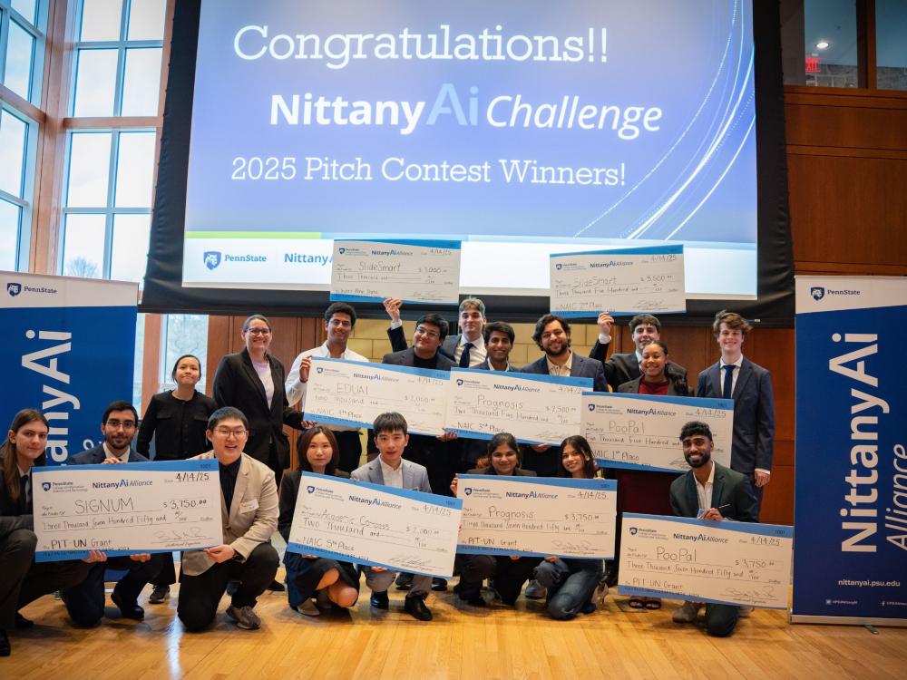 college student winners display giant award checks