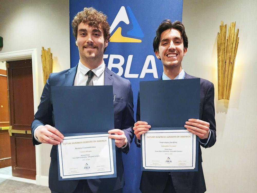 Students hold awards