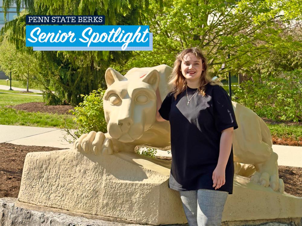 Viktoriia Vozharenko standing by Lion Shrine