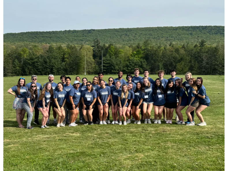 Students standing in field. 