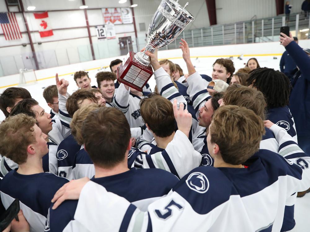 The Penn State Altoona team celebrates their College Hockey East championship win in February.