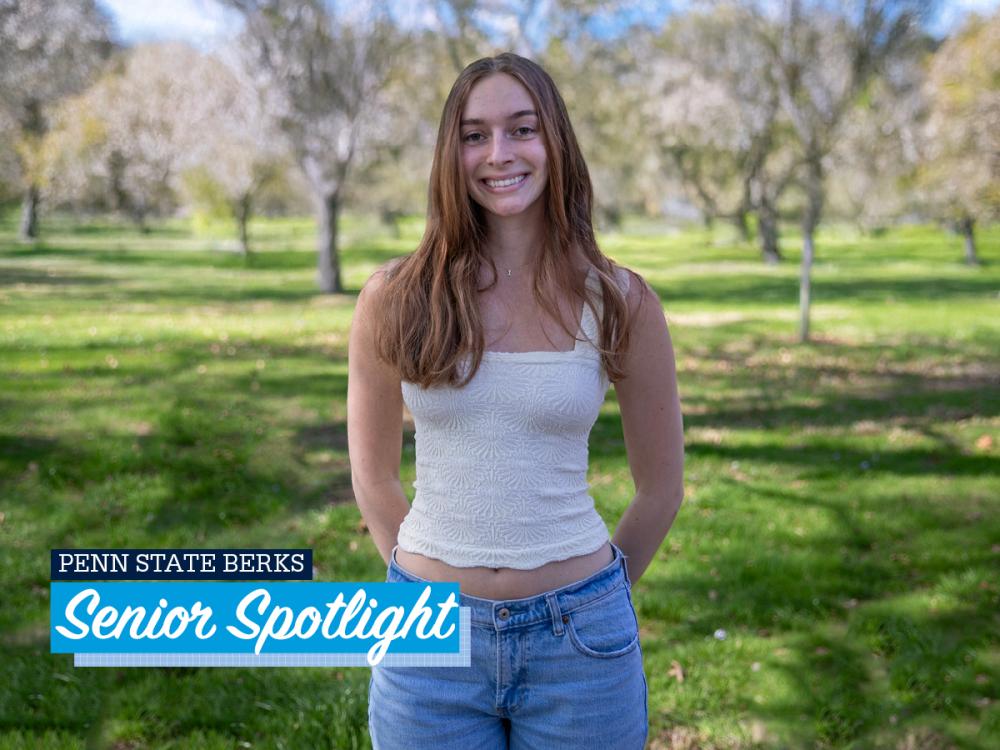 Isabella Romig standing outside on campus