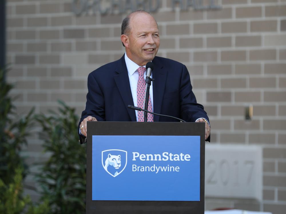Jerry Parsons speaking at podium