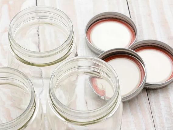 clean and empty glass canning lids and jars
