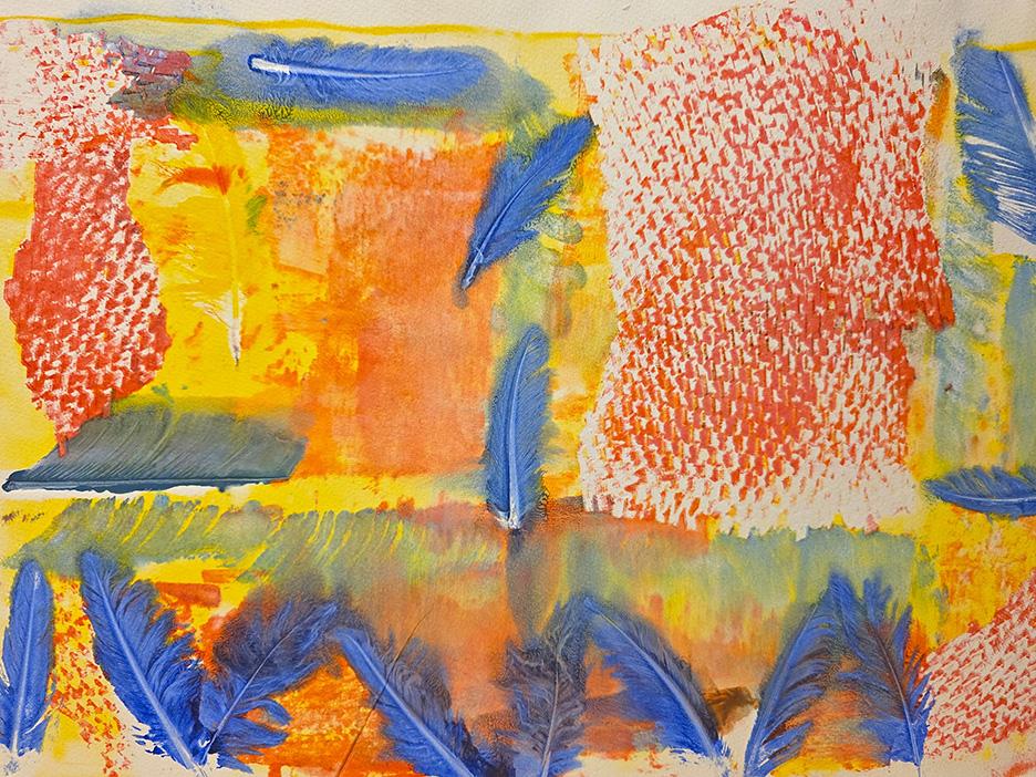 An image of a piece of artwork featuring orange, red, yellow, green and blue tones.