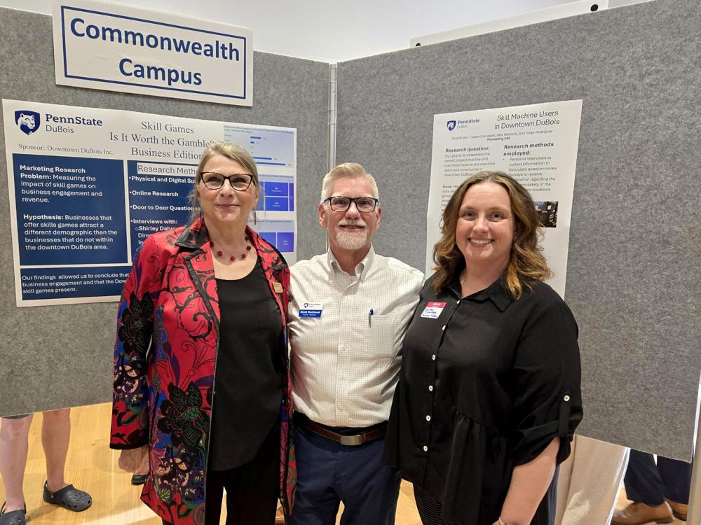 Scott Muirhead (center), lecturer in business administration at Penn State DuBois, stands with Ilona Ballreich (left), program pirector, Sustainable Communities Collaborative, Penn State Sustainability, and Shirley Dahrouge (right), executive director of Downtown DuBois Inc., during the 2025 Campus and Community Sustainability Expo, held April 30 at the Palmer Museum of Art.