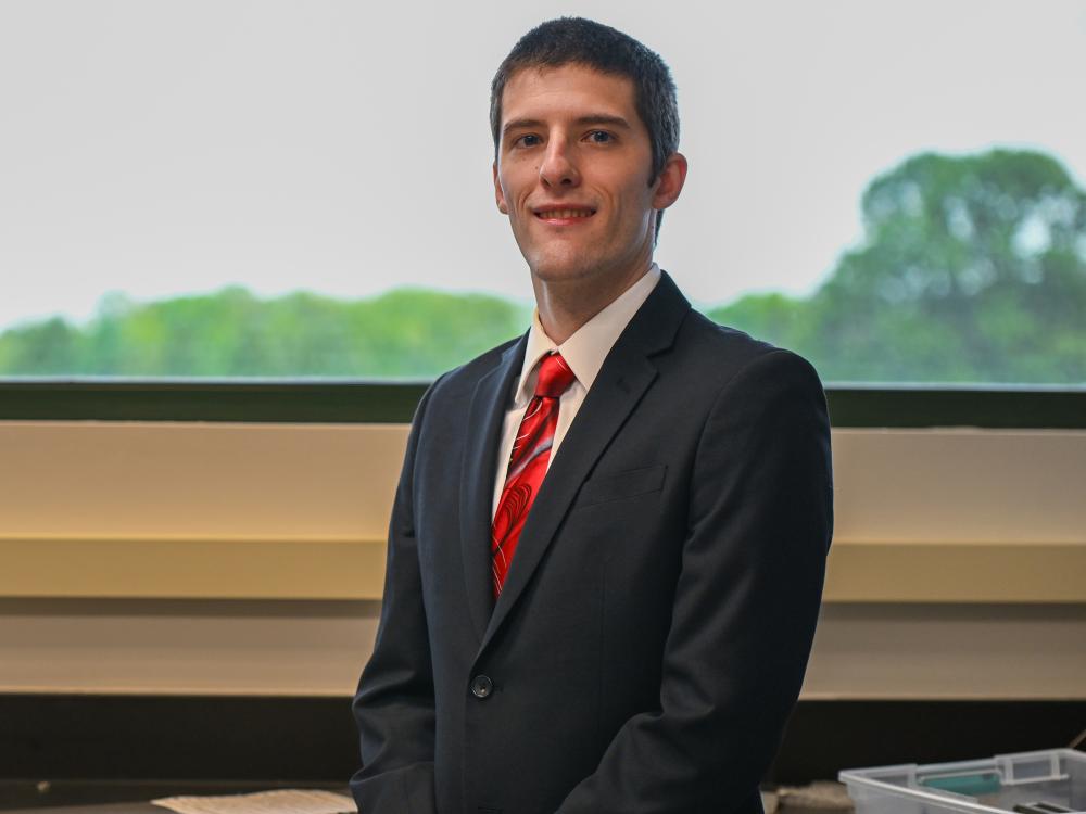 Person standing looking at the camera in an office