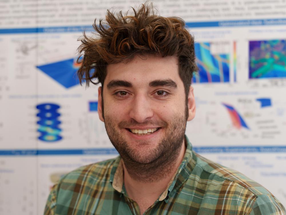 A professional headshot of an individual
