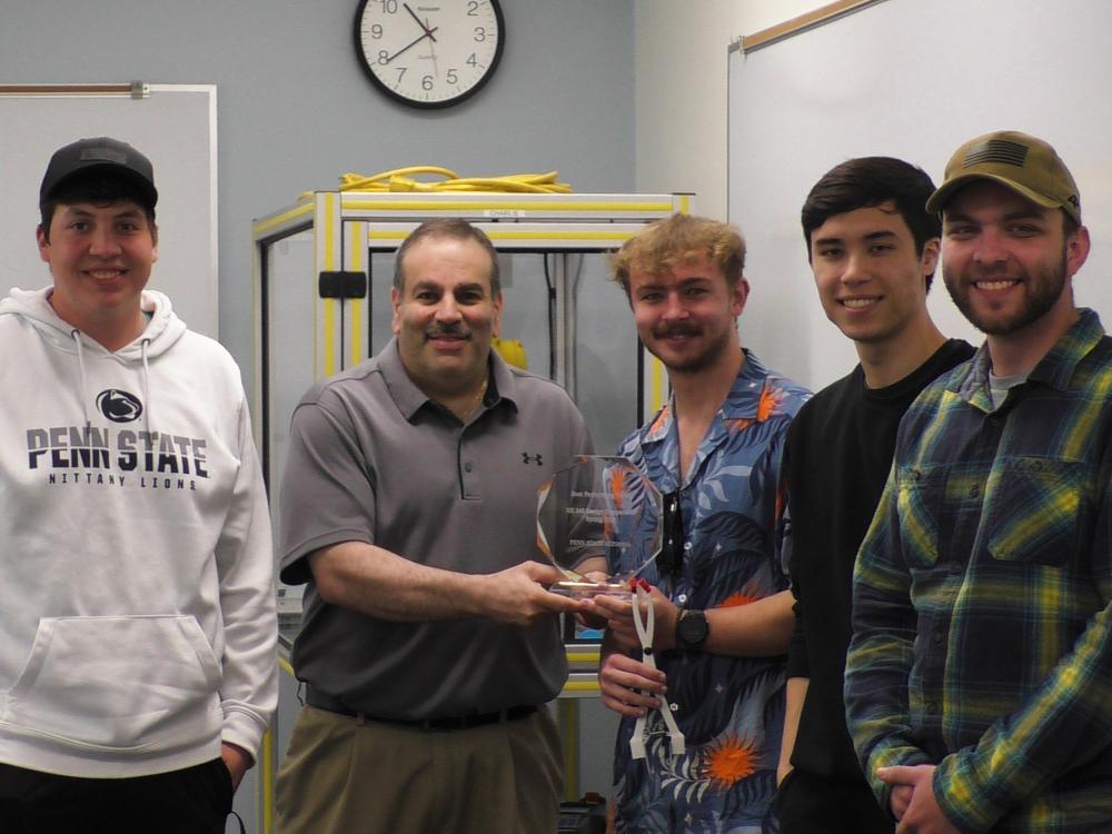 Dr. Grant Risha poses with the student team chosen as best performers in the spring 2025 Engineering Design Competition