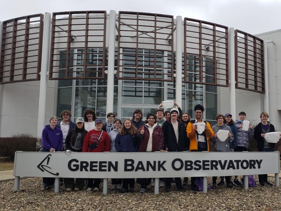 students pose behind Green Bank Observatory sign