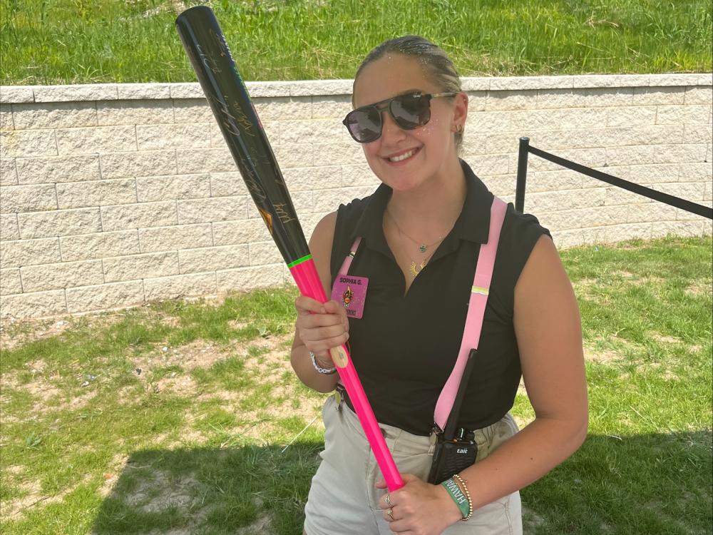 Sophia Galasso holding a bat during her internship with the Savannah Bananas.