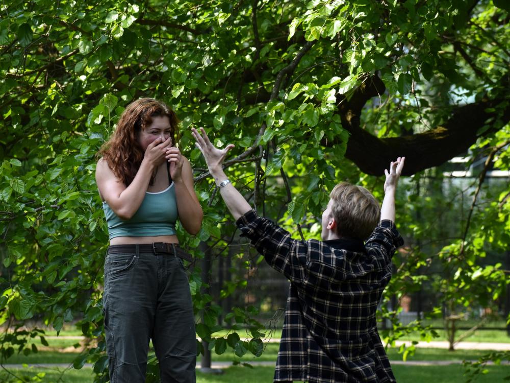 A male and female student rehearse a theater scene.