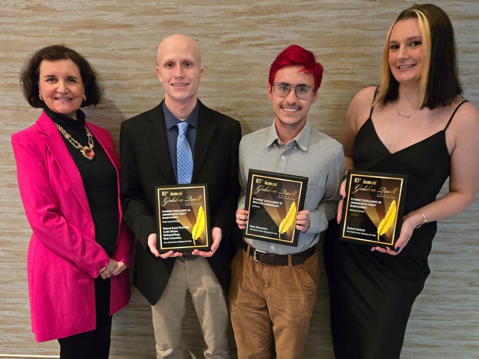 Four people pose for a photo holding Golden Quill award plaques. From left to right: Rosemary Martinelli in a bright pink blazer, Carlin Whalen in a black suit and blue tie, Ryan Amarantes in a gray shirt and glasses with red hair, and Aria Majcher in a black dress.