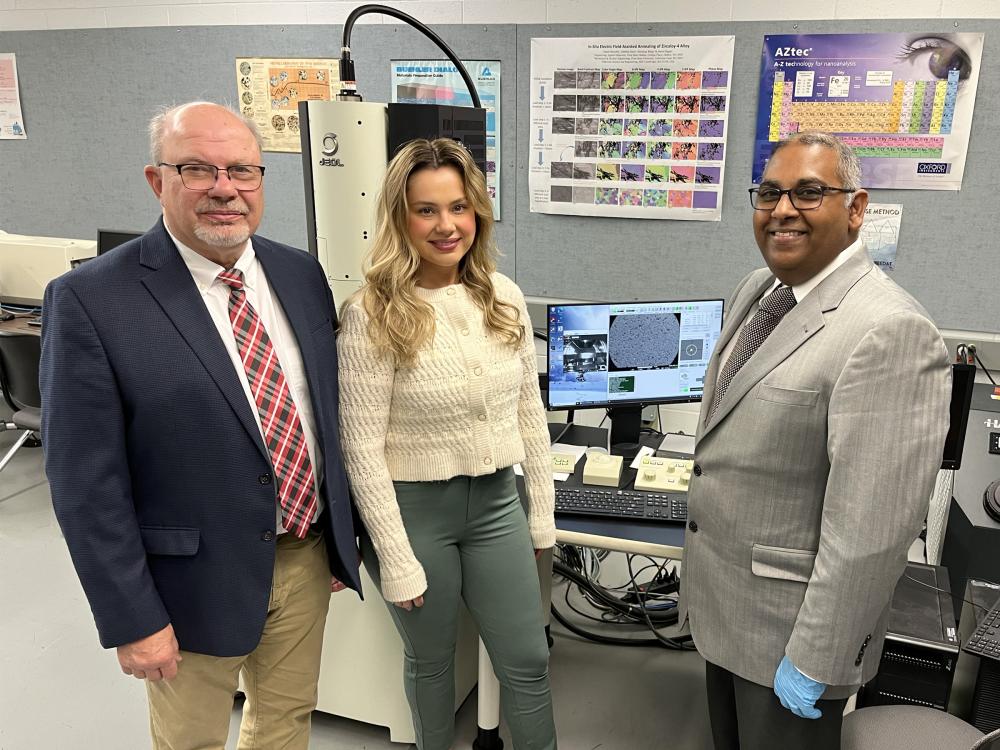 Ramakrishnan Rajagopalan, professor of engineering at Penn State DuBois, right, stands next to Tony Zaffuto, president of Metaltech, left, and Bethany Zaffuto, marketing lead for Metaltech, center, in one of the engineering labs at Penn State DuBois.