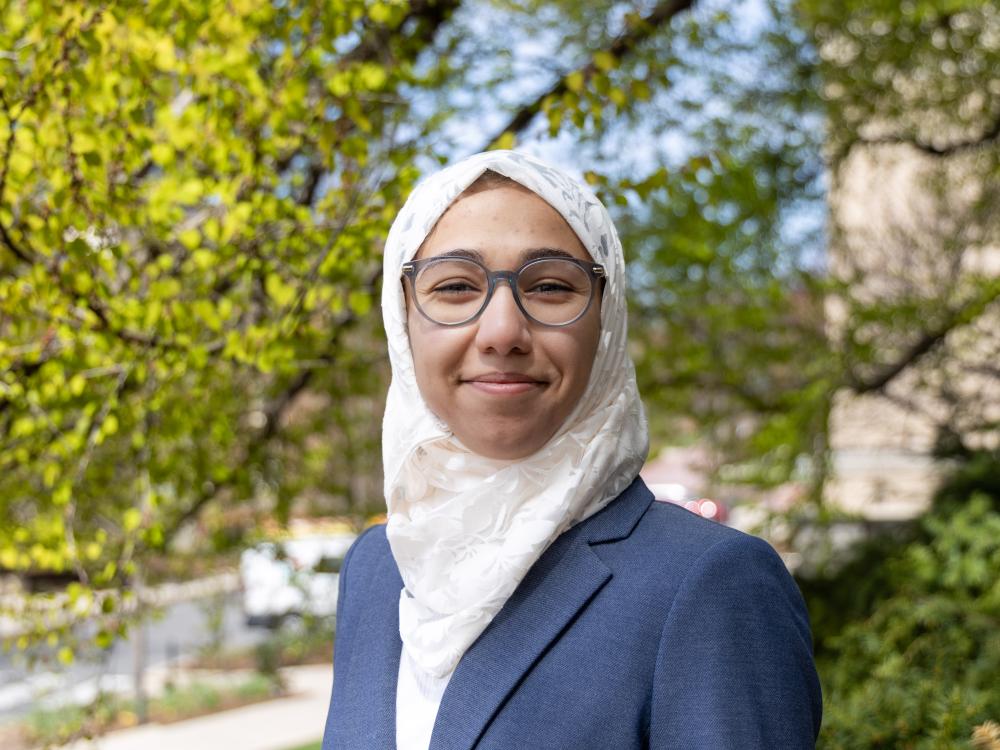 Fatmah Almeer stands in front of a tree at Penn State University Park.