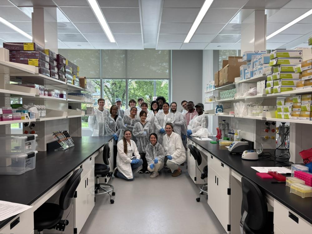 Students gather in lab setting