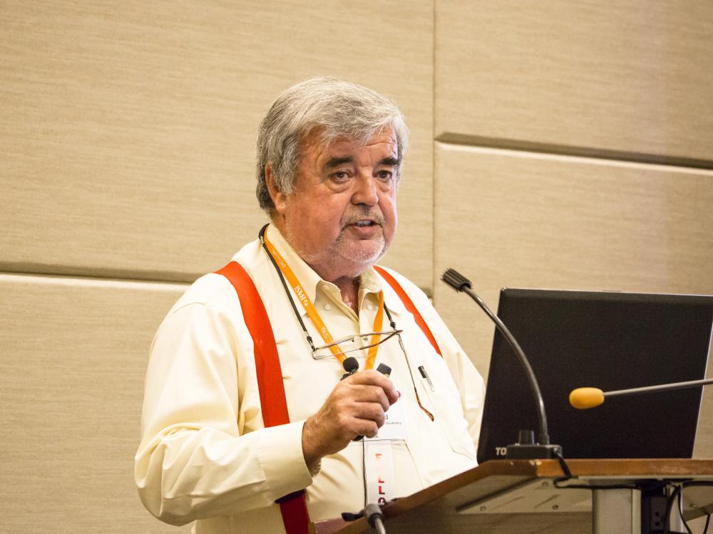Man speaking at a podium